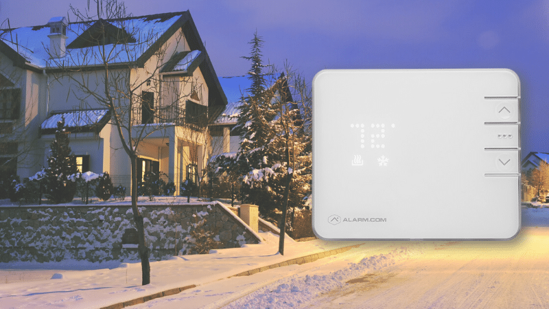image of a thermostat over a snowy street